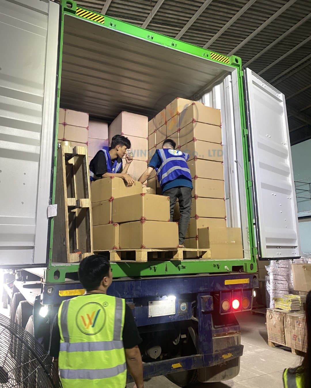 Loading natural loofah cartons into an export shipping container